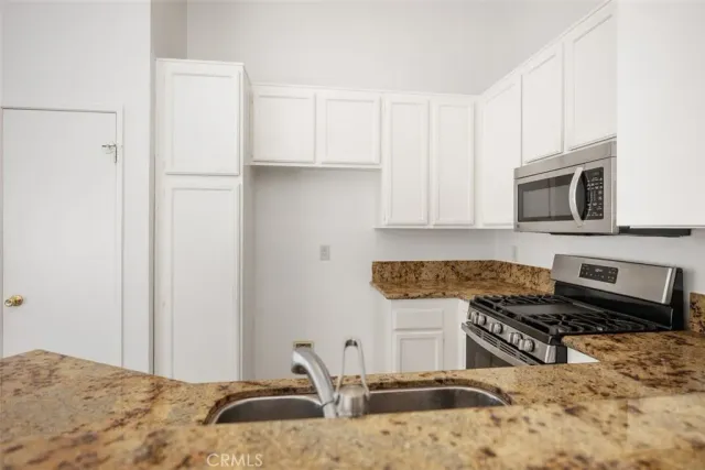 a spacious bathroom with a double vanity sink and mirror