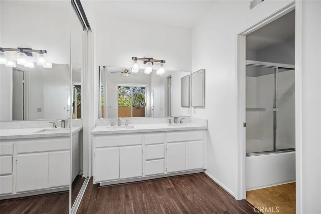 19431 Rue De Valore Lake Forest, CA 92610 - Photo 17 of 30 a spacious bathroom with a double vanity sink and mirror