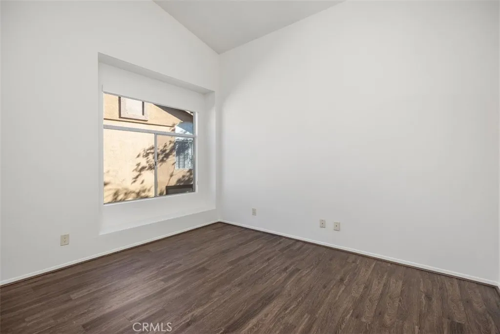 19431 Rue De Valore Lake Forest, CA 92610 - Photo 18 of 30 an empty room with wooden floor and windows