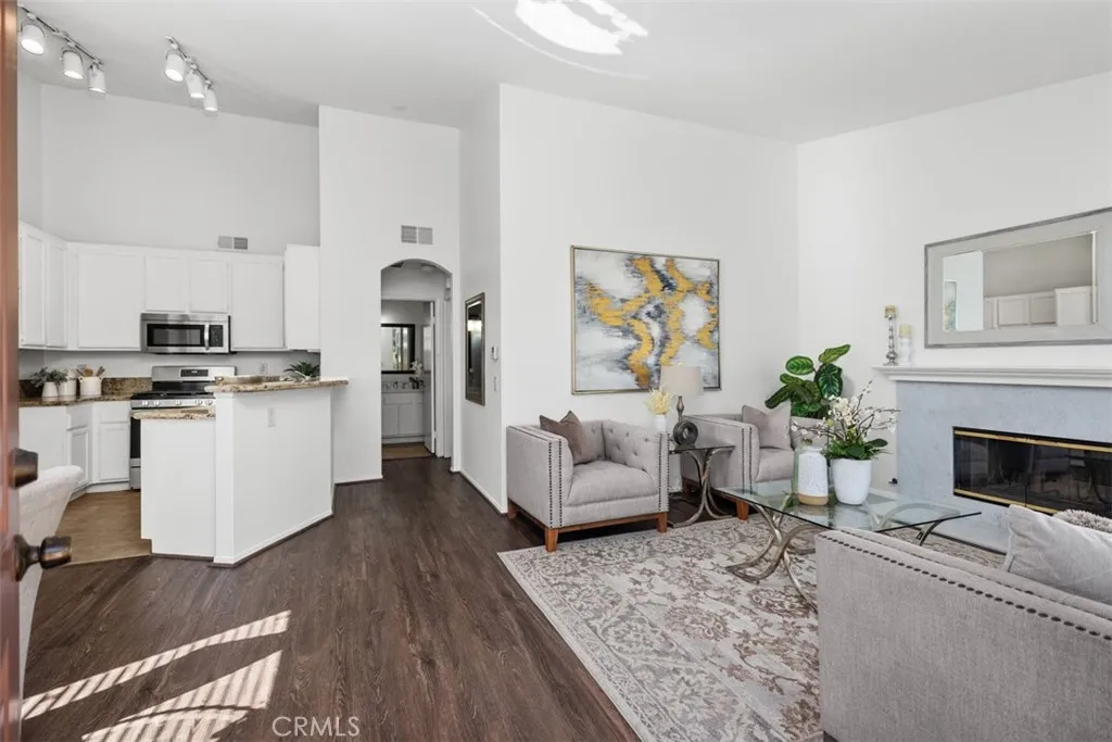 a living room with furniture and a fireplace