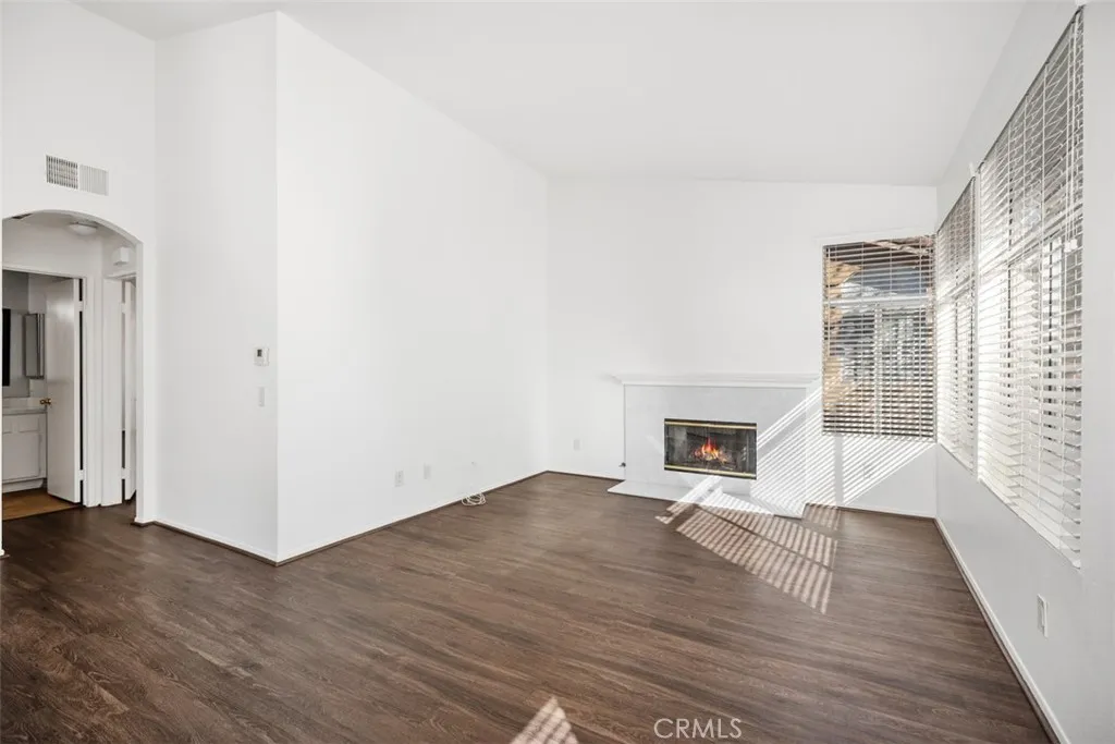 19431 Rue De Valore Lake Forest, CA 92610 - Photo 3 of 30 a view of a livingroom with wooden floor and a fireplace