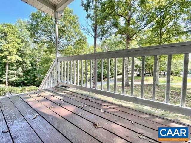 13 Riverside Drive Palmyra, VA 22963 - Photo 2 of 25 a view of balcony with wooden floor and fence