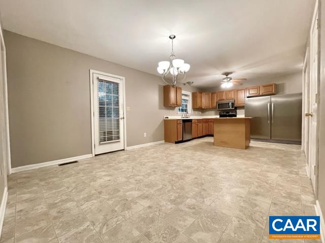 13 Riverside Drive Palmyra, VA 22963 - Photo 5 of 25 a view of a kitchen with a sink and a refrigerator