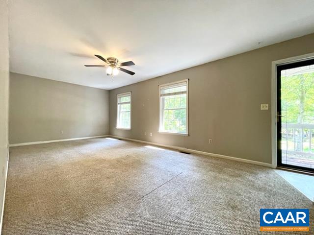 13 Riverside Drive Palmyra, VA 22963 - Photo 9 of 25 an empty room with windows and ceiling fan