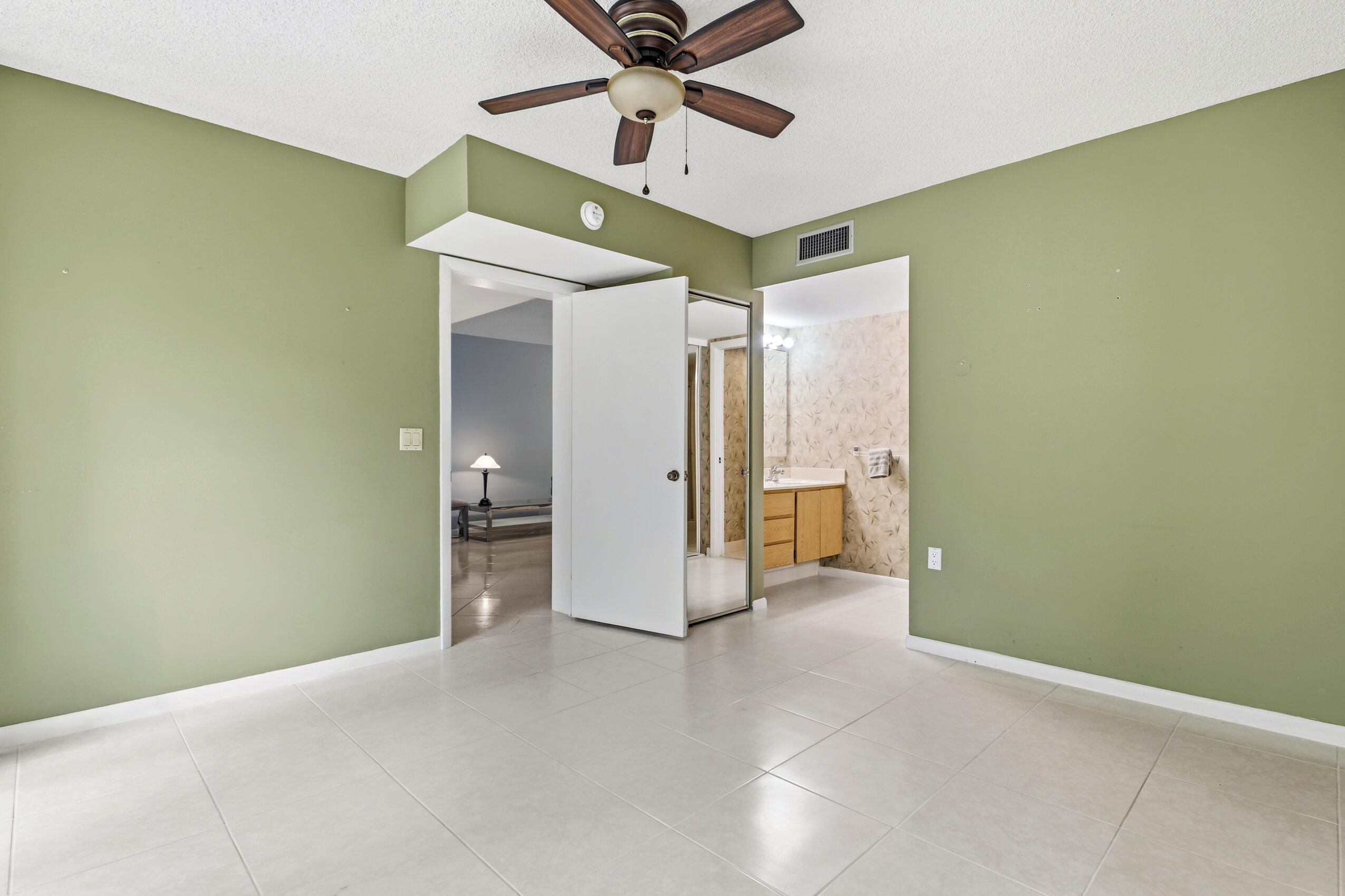 6145 Balboa Circle, Unit 103 Boca Raton, FL 33433 - Photo 12 of 31 a view of a livingroom with a ceiling fan & a ceiling fan