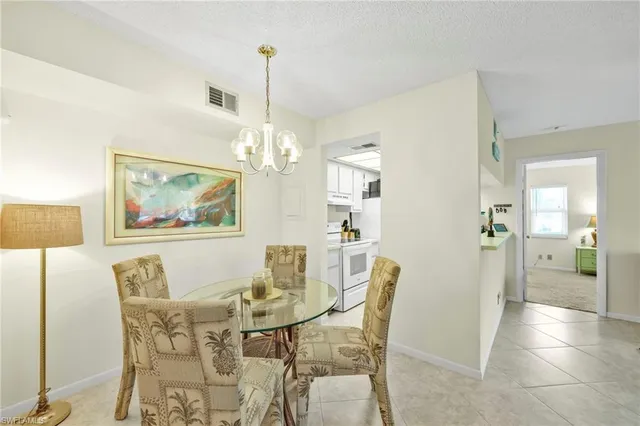 a kitchen with a sink and a refrigerator
