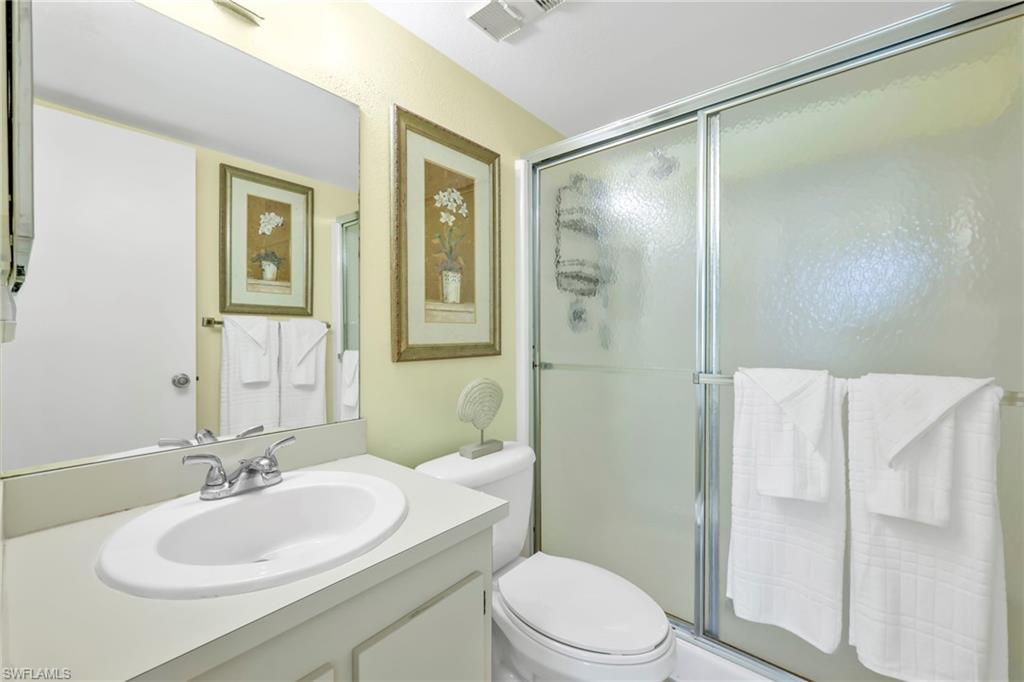 4287 27th Court Southwest, Unit 202 Naples, FL 34116 - Photo 4 of 17 a bathroom with a sink toilet and shower