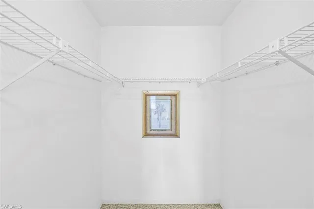 a view of a room with furniture and wooden floor