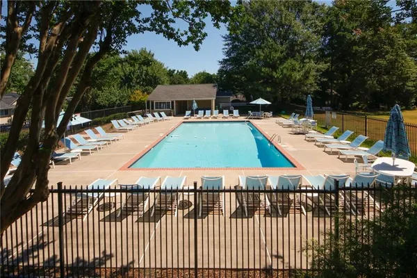 a view of a swimming pool with a lounge chairs