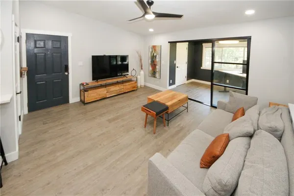 a living room with furniture and a flat screen tv