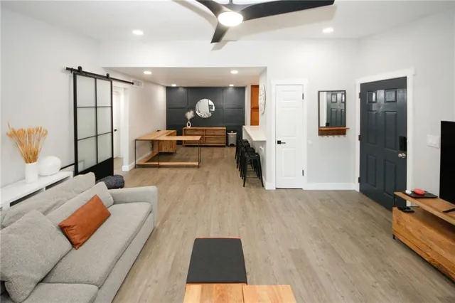 a living room with furniture and a table