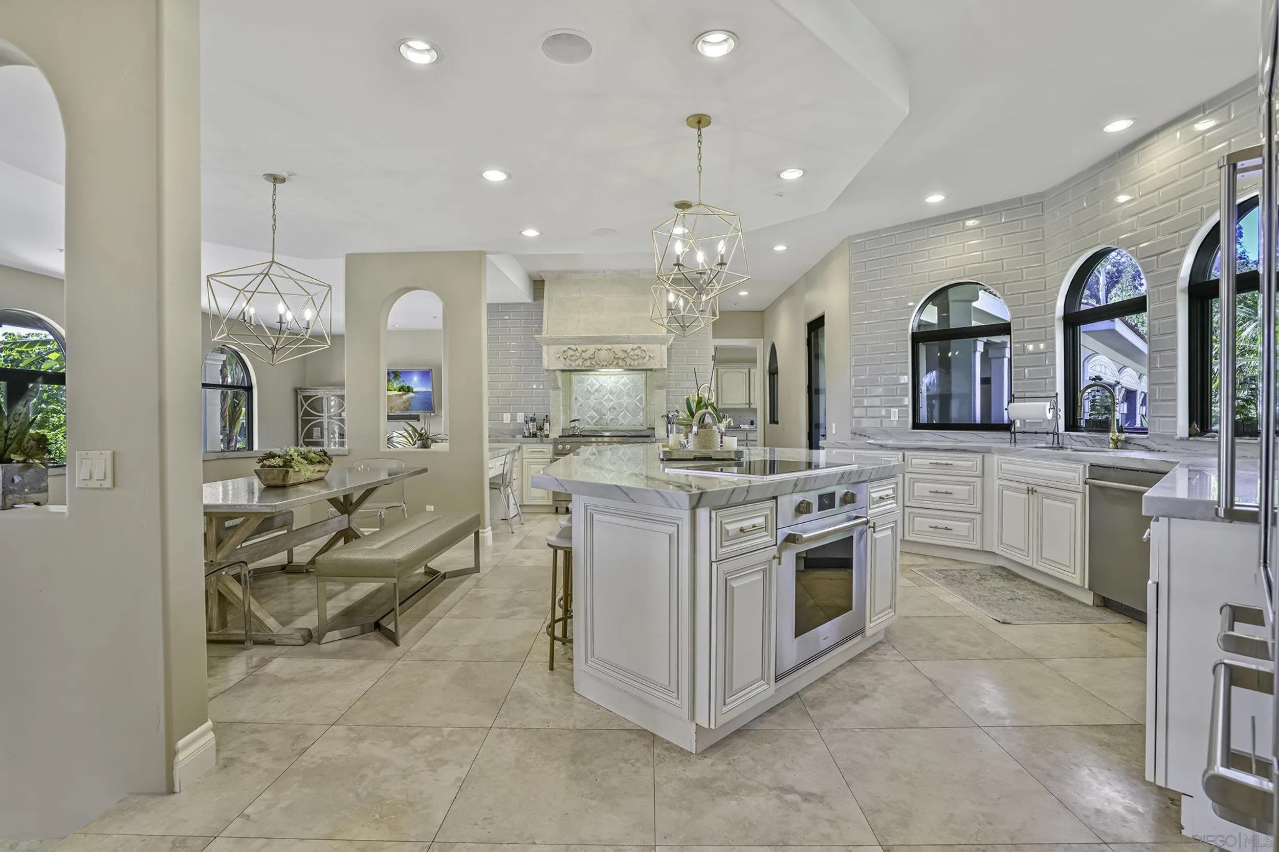 5305 La Crescenta Road Rancho Santa Fe, CA 92067 - Photo 10 of 63 The ultimate chef's kitchen has been tastefully remodeled and includes both Wolf gas range with griddle and Wolf induction cooktop and additional Wolf oven.