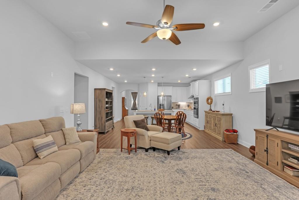 1598 Auburn Rdg Way Dacula, GA 30019 - Photo 13 of 34 a living room with furniture kitchen view and a chandelier