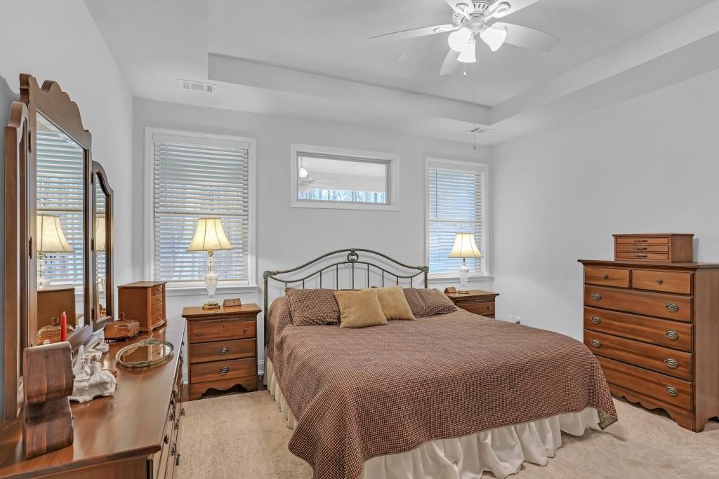 1598 Auburn Rdg Way Dacula, GA 30019 - Photo 15 of 34 a bedroom with a bed and wooden floor