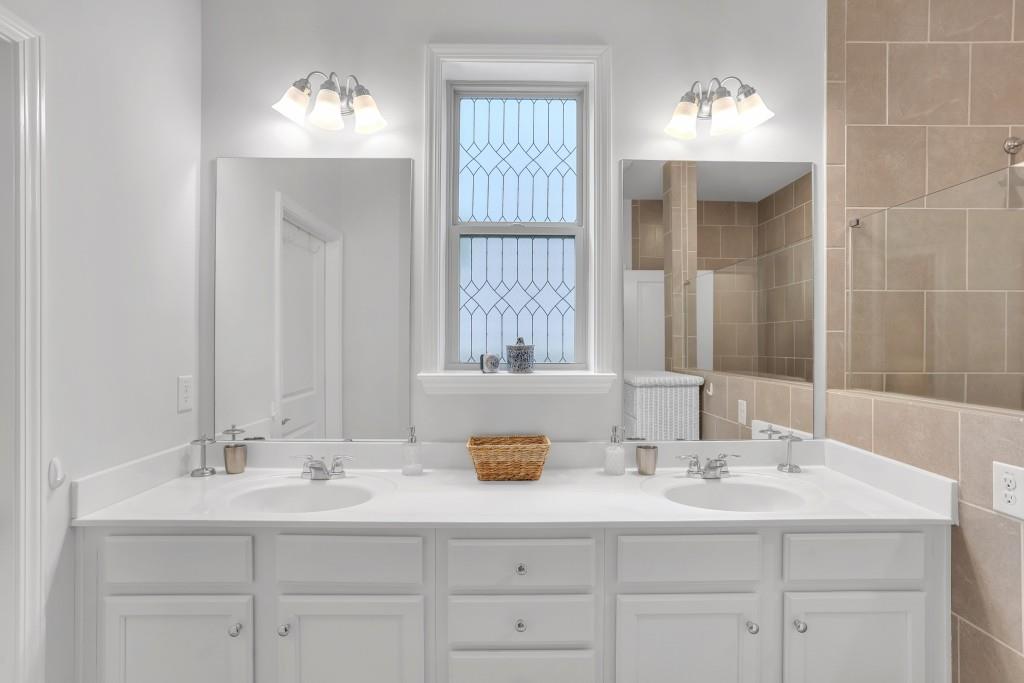 1598 Auburn Rdg Way Dacula, GA 30019 - Photo 18 of 34 a bathroom with double sink and a mirror