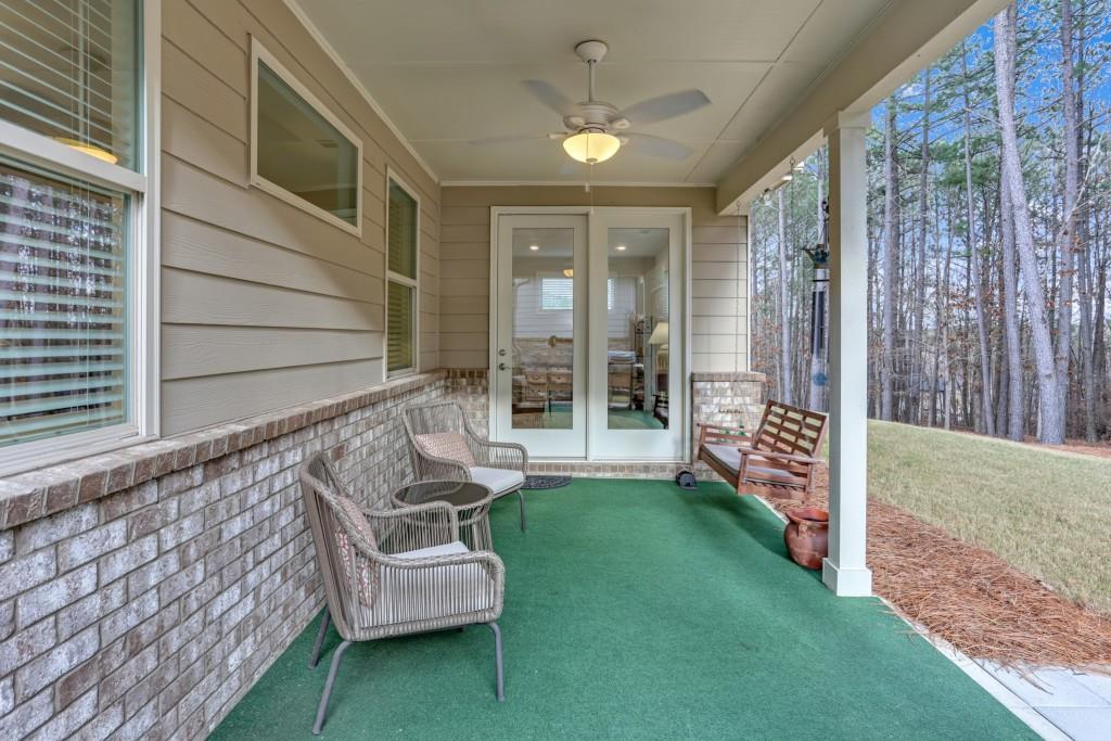 1598 Auburn Rdg Way Dacula, GA 30019 - Photo 25 of 34 a view of a chair and fire pit in backyard of the house