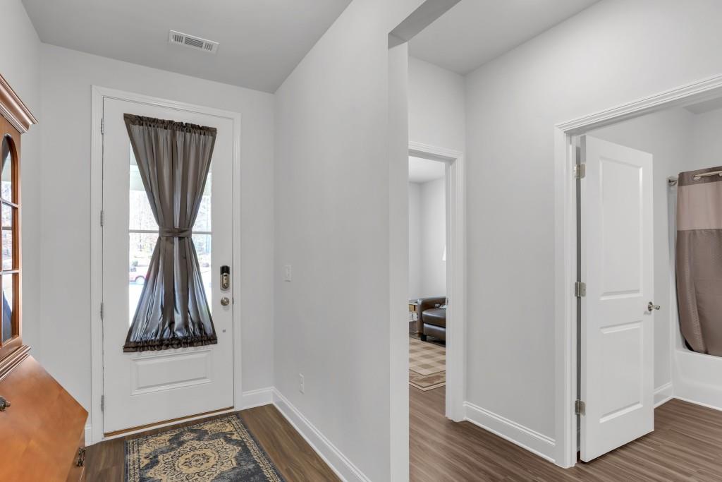 1598 Auburn Rdg Way Dacula, GA 30019 - Photo 3 of 34 a view of hallway with wooden floor