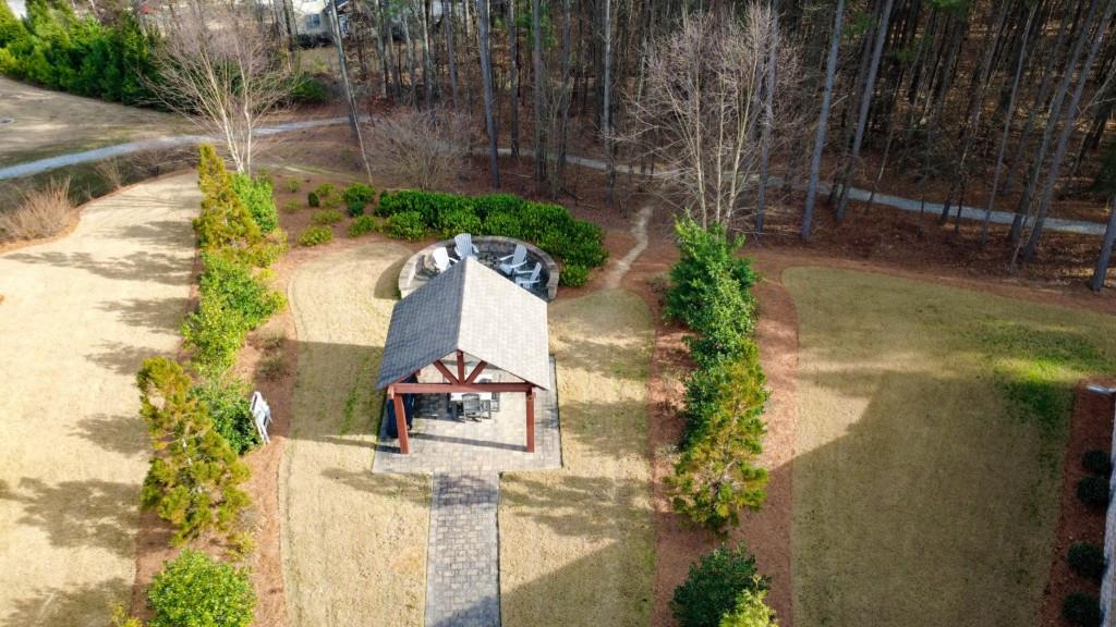 1598 Auburn Rdg Way Dacula, GA 30019 - Photo 31 of 34 a view of a garden with a bench