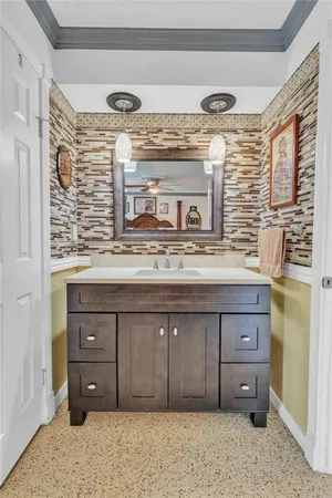 a view of backyard with deck and garden