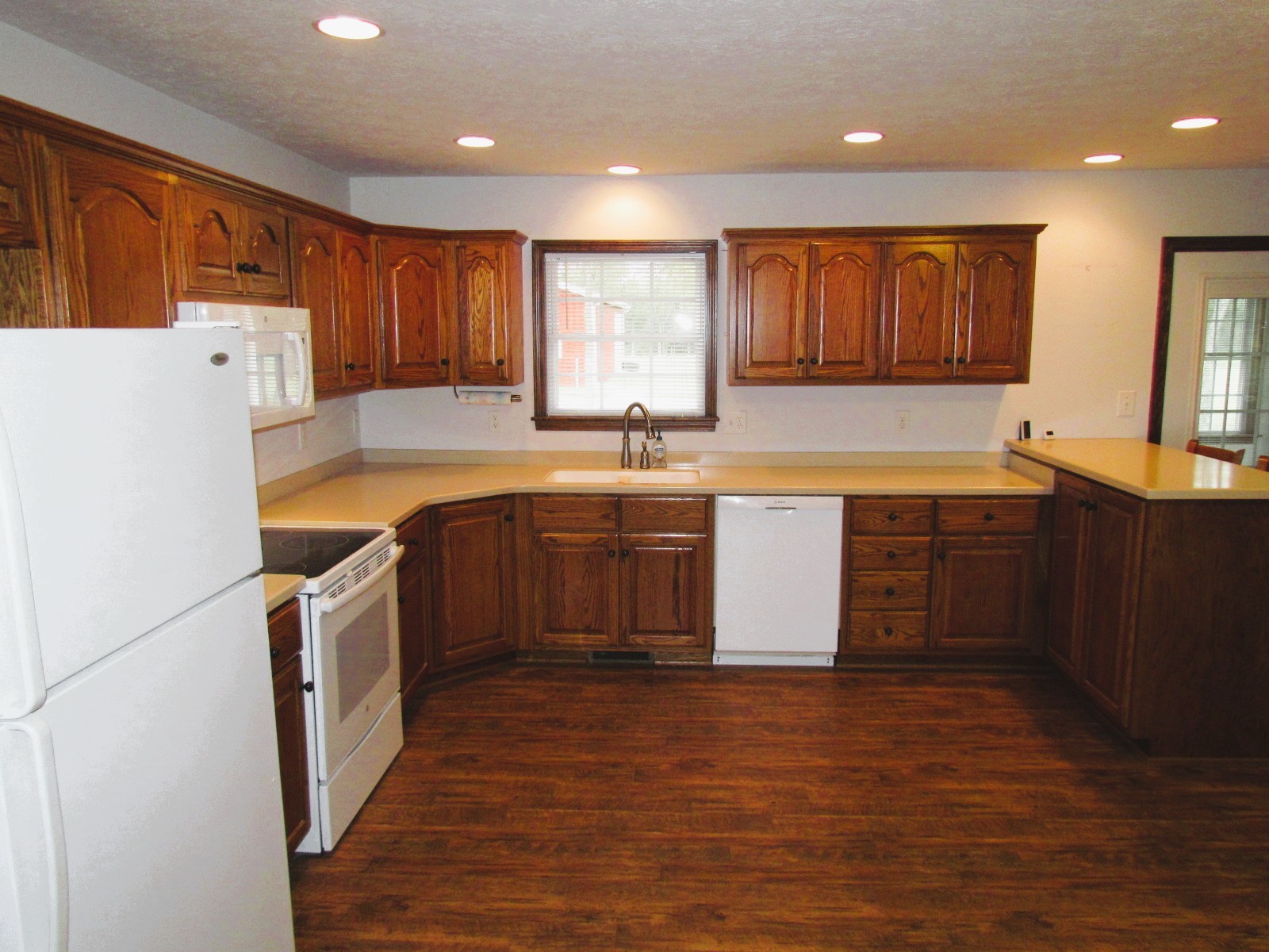 1266 Poplar Hill Road Watertown, TN 37184 - Photo 11 of 59 a kitchen with a sink a counter top space and stainless steel appliances