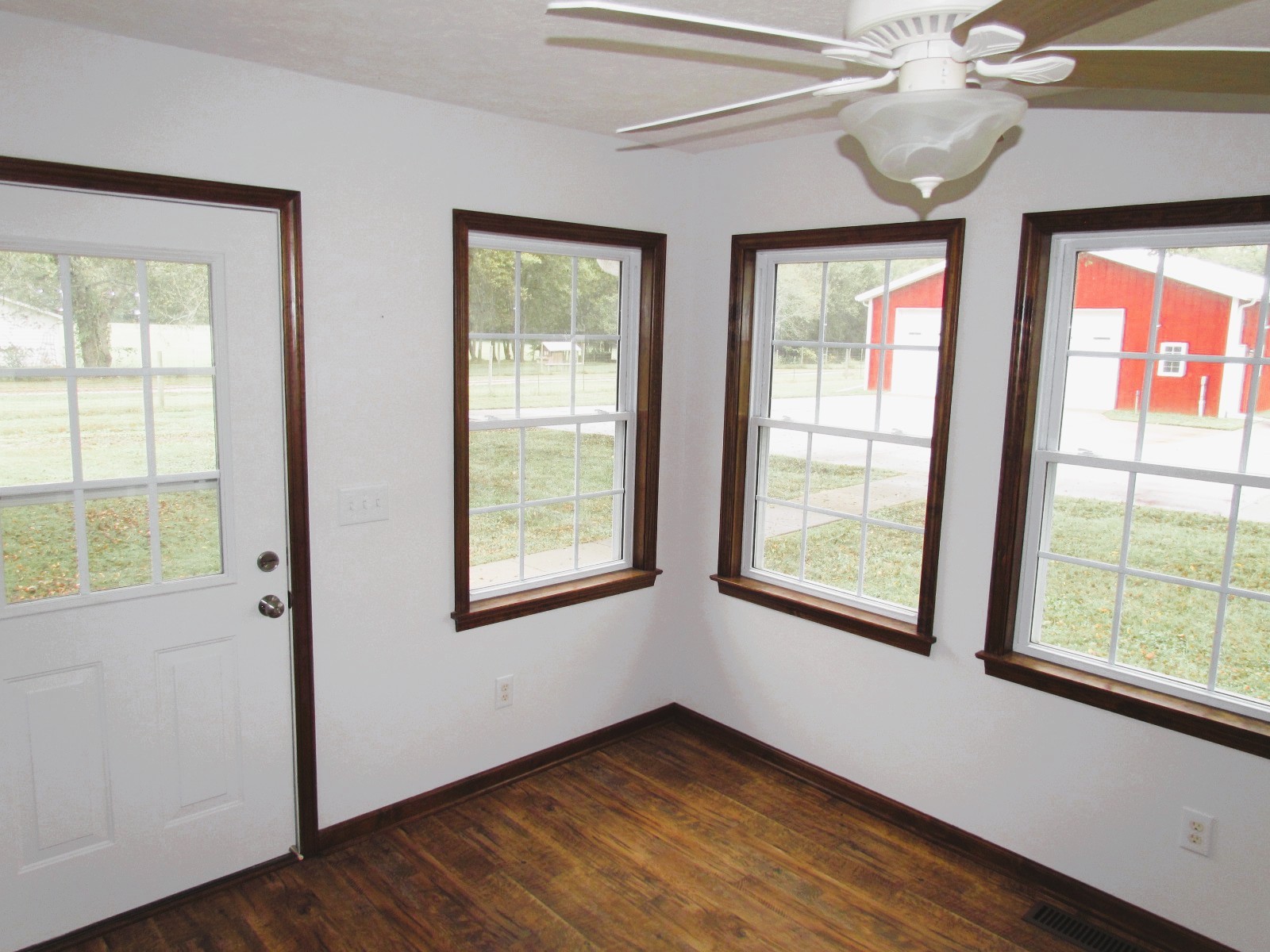 1266 Poplar Hill Road Watertown, TN 37184 - Photo 14 of 59 a view of an empty room with wooden floor and a window