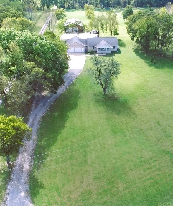 1266 Poplar Hill Road Watertown, TN 37184 - Photo 2 of 59 a view of a garden with a lake