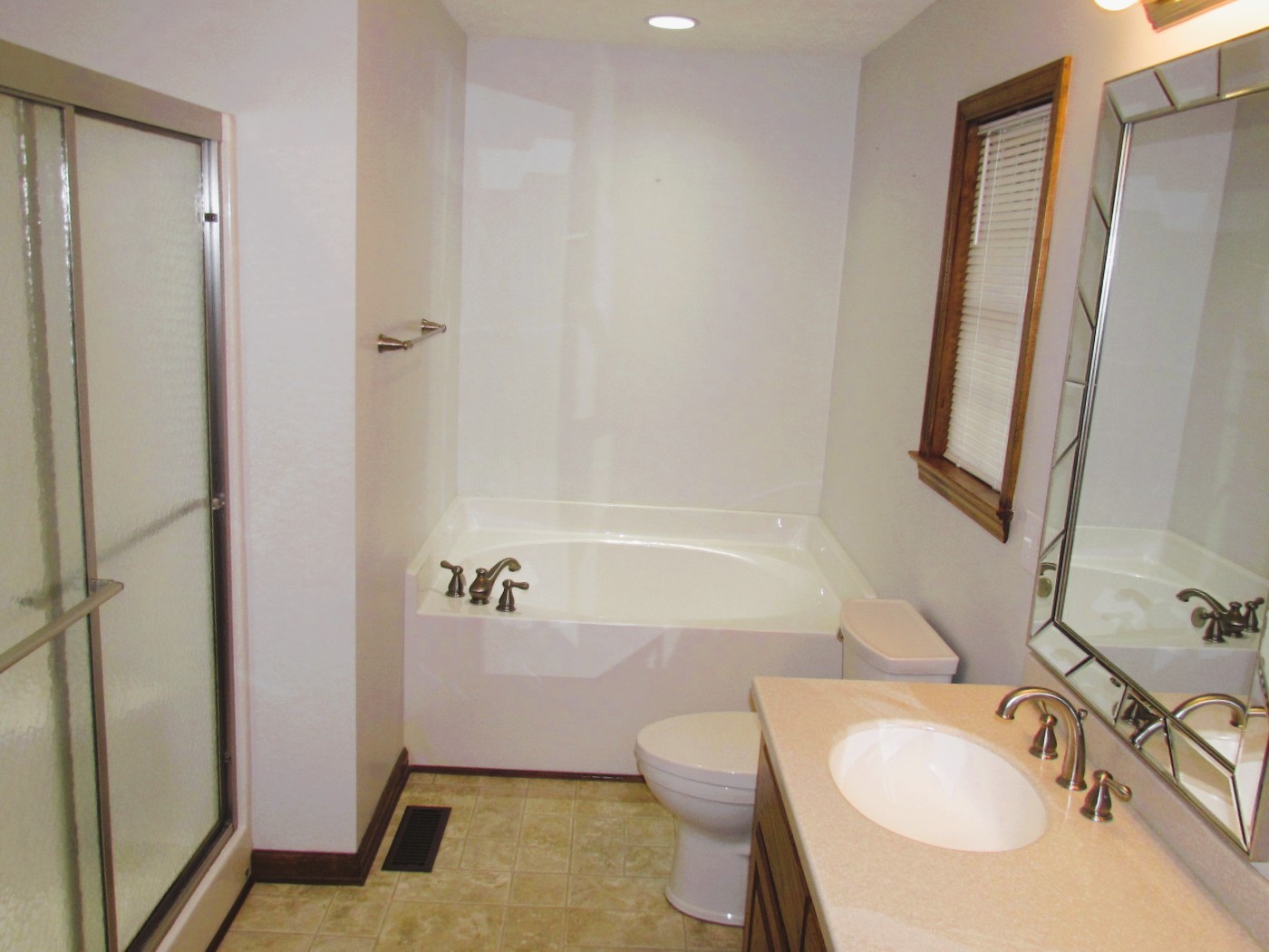 1266 Poplar Hill Road Watertown, TN 37184 - Photo 21 of 59 a bathroom with a sink a toilet and shower a mirror