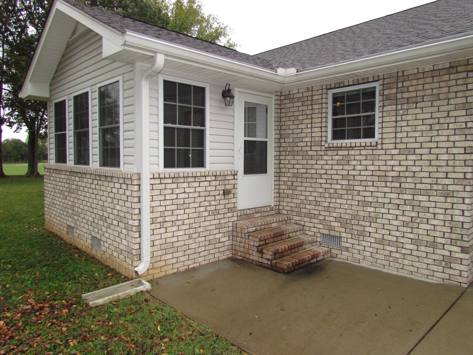 1266 Poplar Hill Road Watertown, TN 37184 - Photo 38 of 59 a view of a brick house with a yard