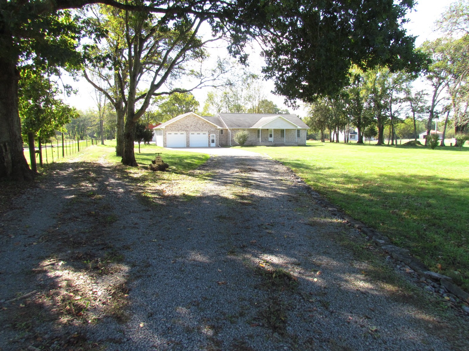 1266 Poplar Hill Road Watertown, TN 37184 - Photo 48 of 59 a view of a yard with a tree in the background