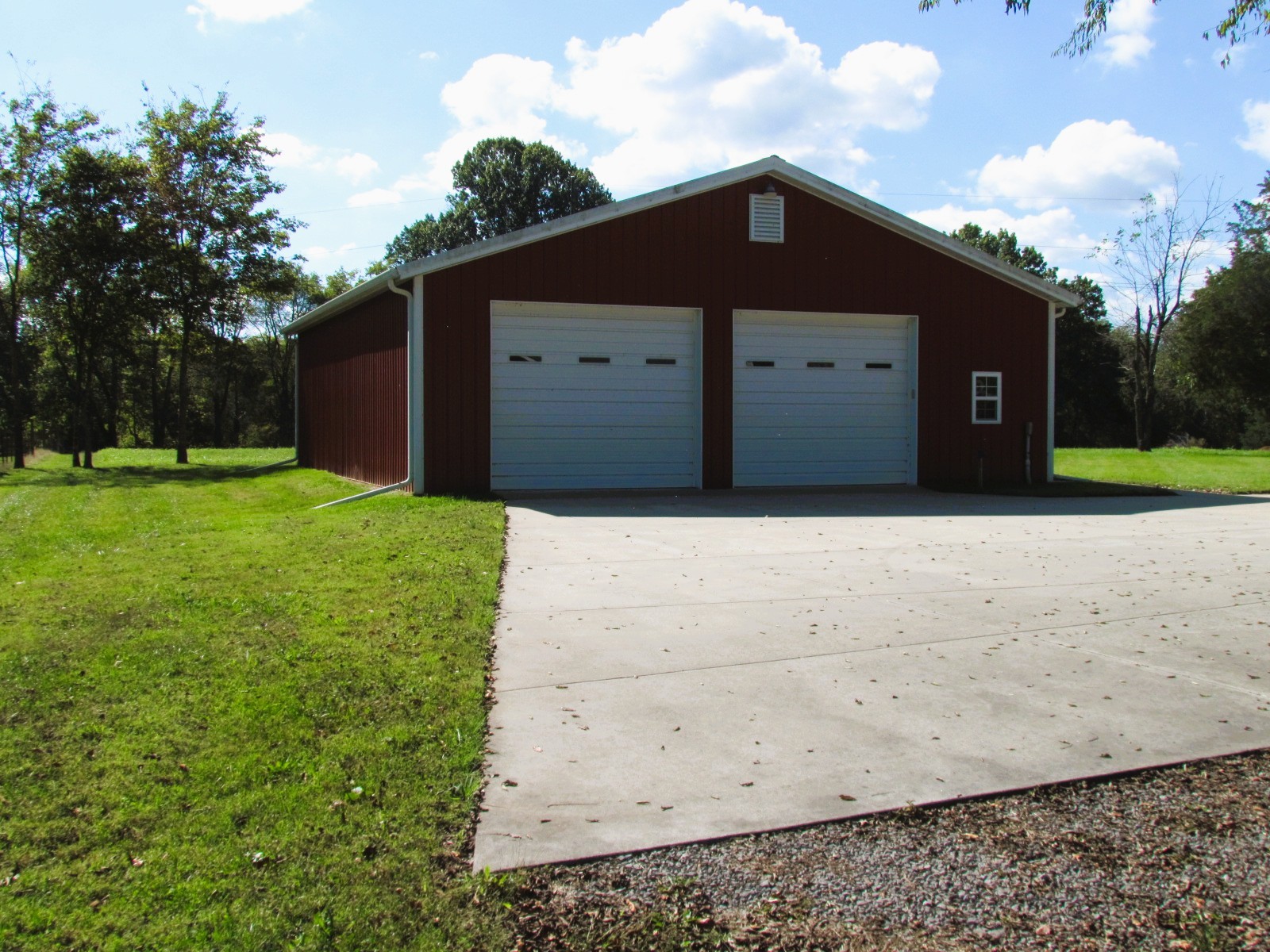 1266 Poplar Hill Road Watertown, TN 37184 - Photo 51 of 59 a front view of a house with a yard and garage