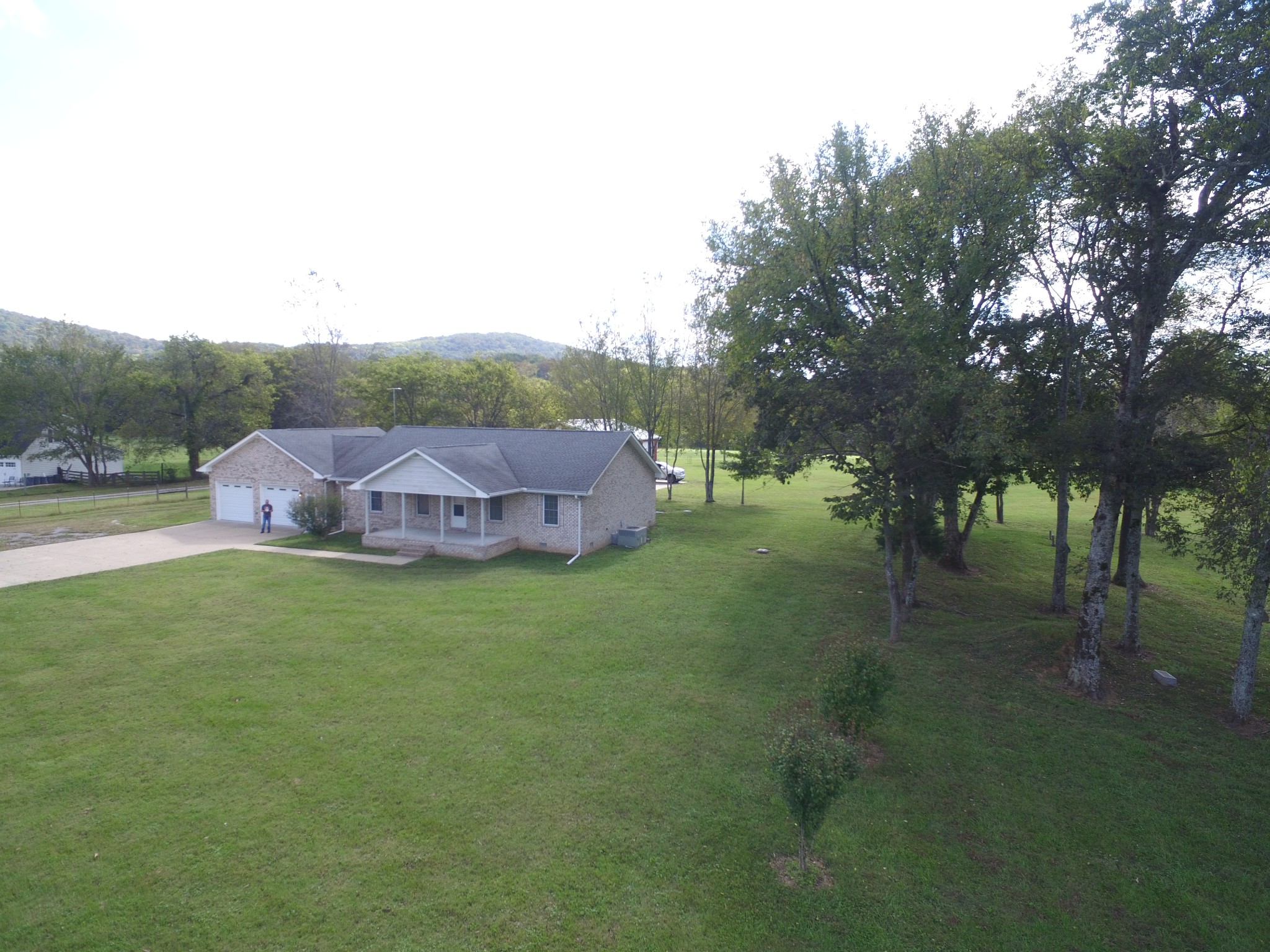1266 Poplar Hill Road Watertown, TN 37184 - Photo 59 of 59 a backyard of a house with table and chairs