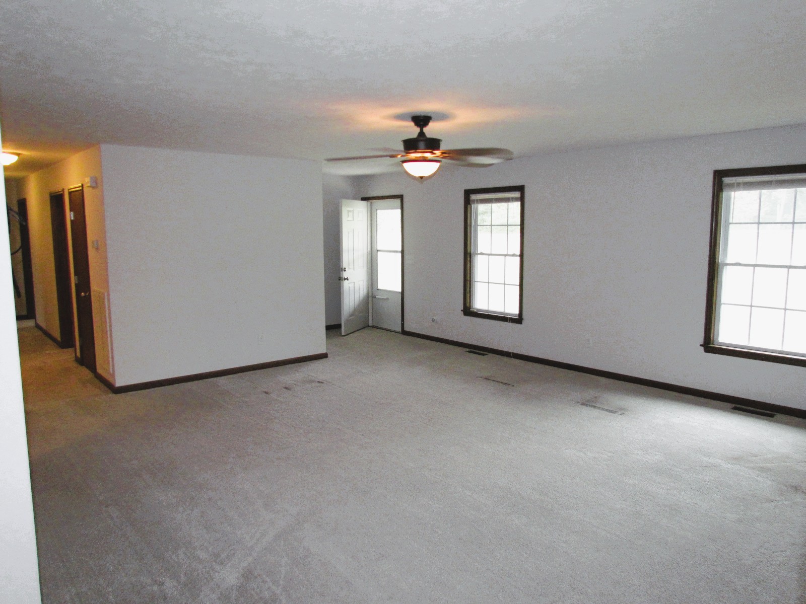 1266 Poplar Hill Road Watertown, TN 37184 - Photo 6 of 59 an empty room with windows and cabinet