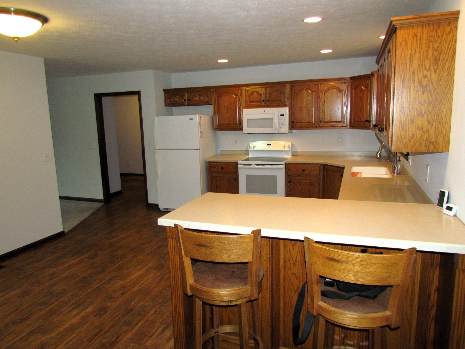 1266 Poplar Hill Road Watertown, TN 37184 - Photo 9 of 59 a kitchen with a table chairs stove and refrigerator