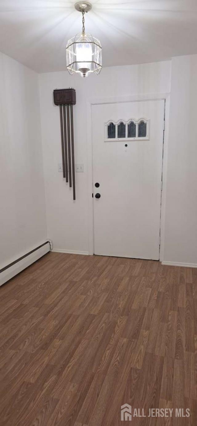 33 Nottingham Road Edison, NJ 08820 - Photo 6 of 6 a view of an empty room with wooden floor