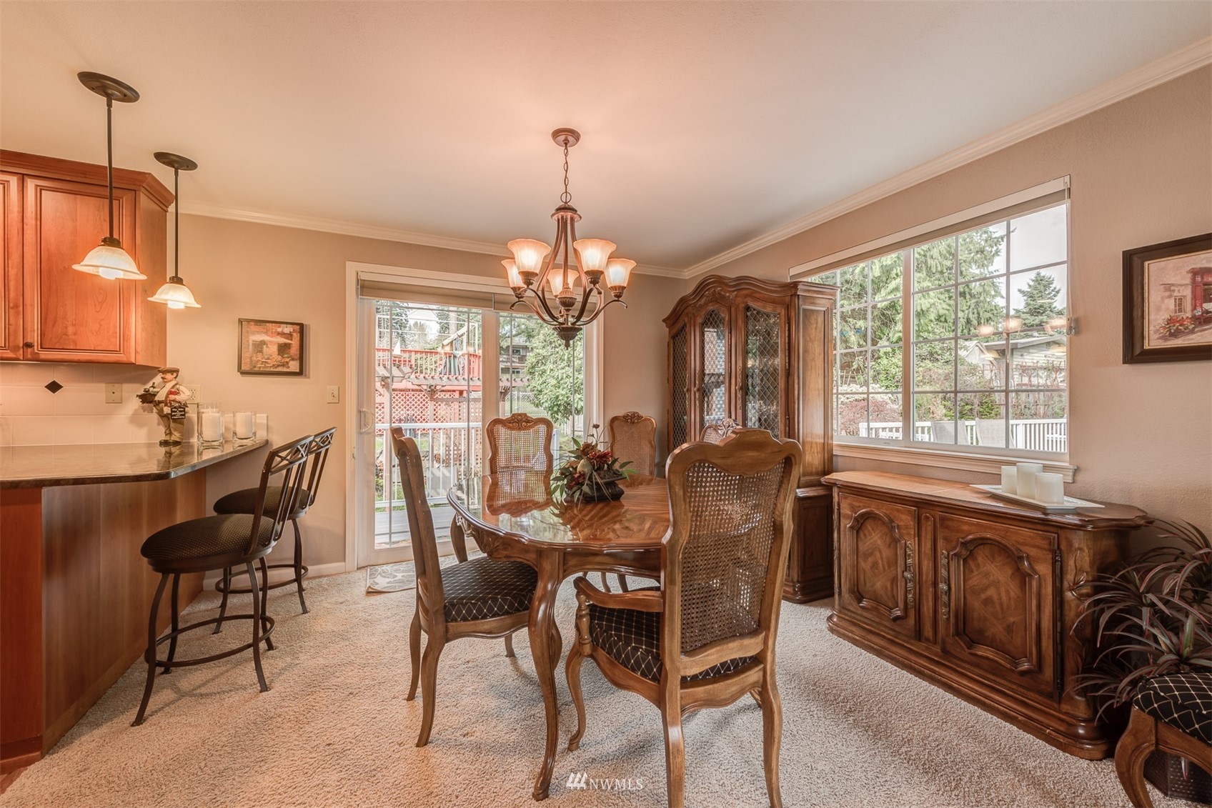 213 155th Place Southeast Bothell, WA 98012 - Photo 12 of 37 a dining room with furniture a chandelier and wooden floor
