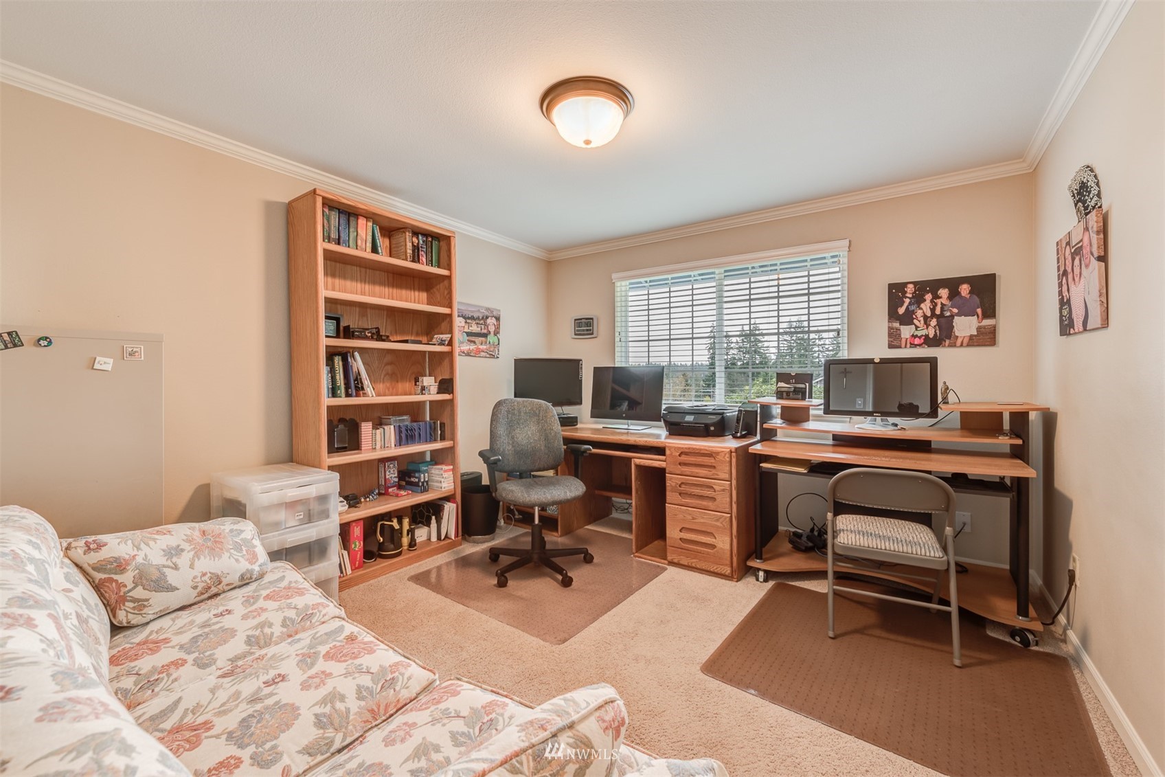 213 155th Place Southeast Bothell, WA 98012 - Photo 16 of 37 a view of a livingroom with workspace and a couch