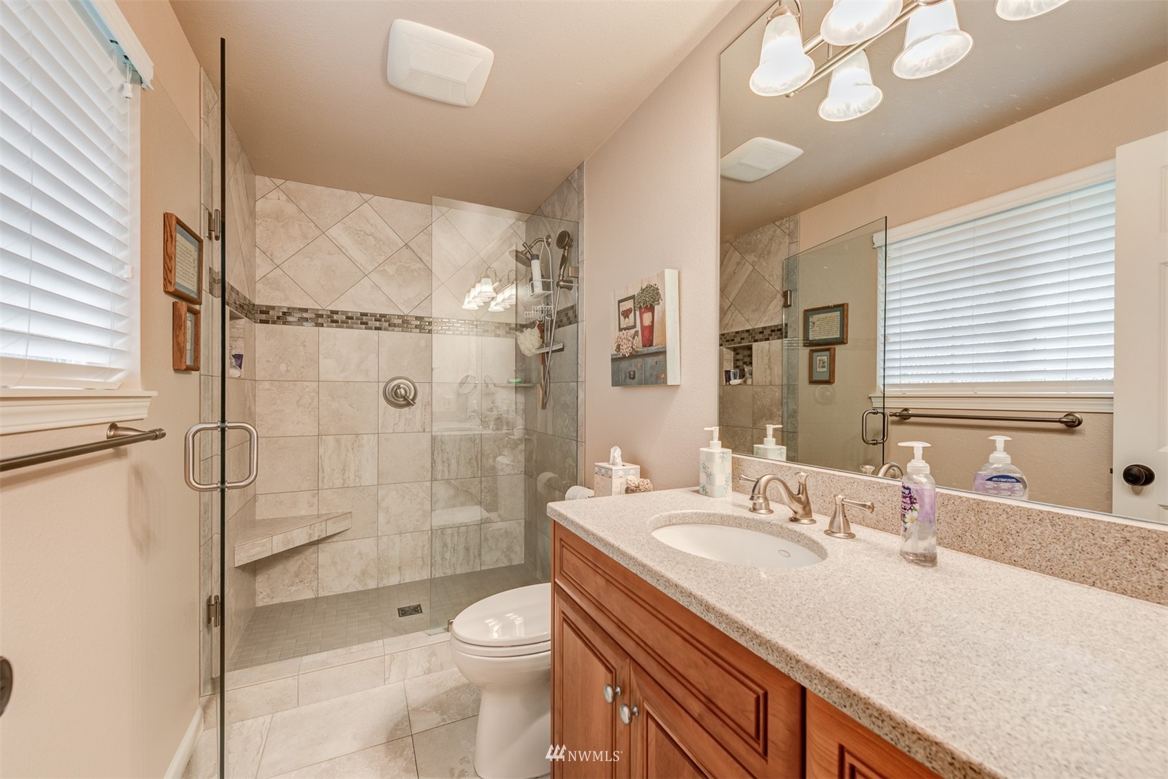 213 155th Place Southeast Bothell, WA 98012 - Photo 17 of 37 a bathroom with a sink a toilet and shower