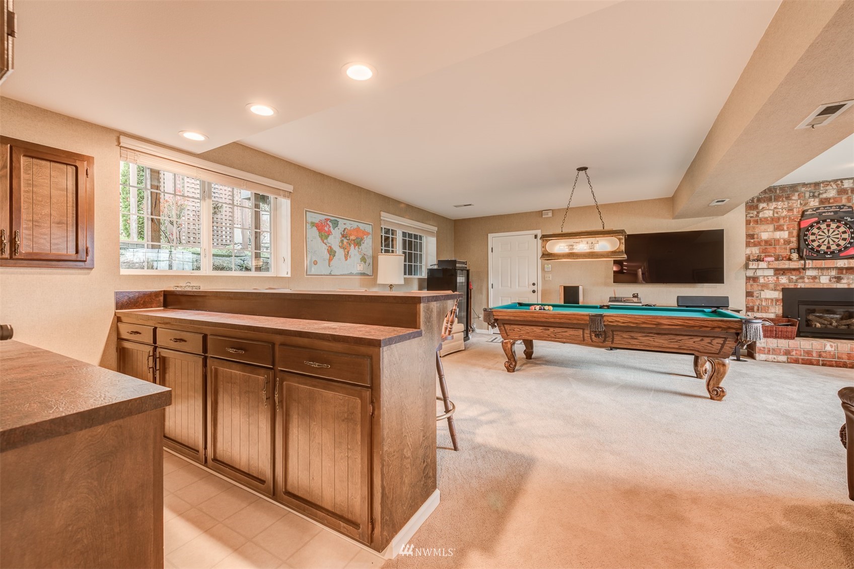 213 155th Place Southeast Bothell, WA 98012 - Photo 20 of 37 a kitchen with stainless steel appliances kitchen island granite countertop a stove and cabinets