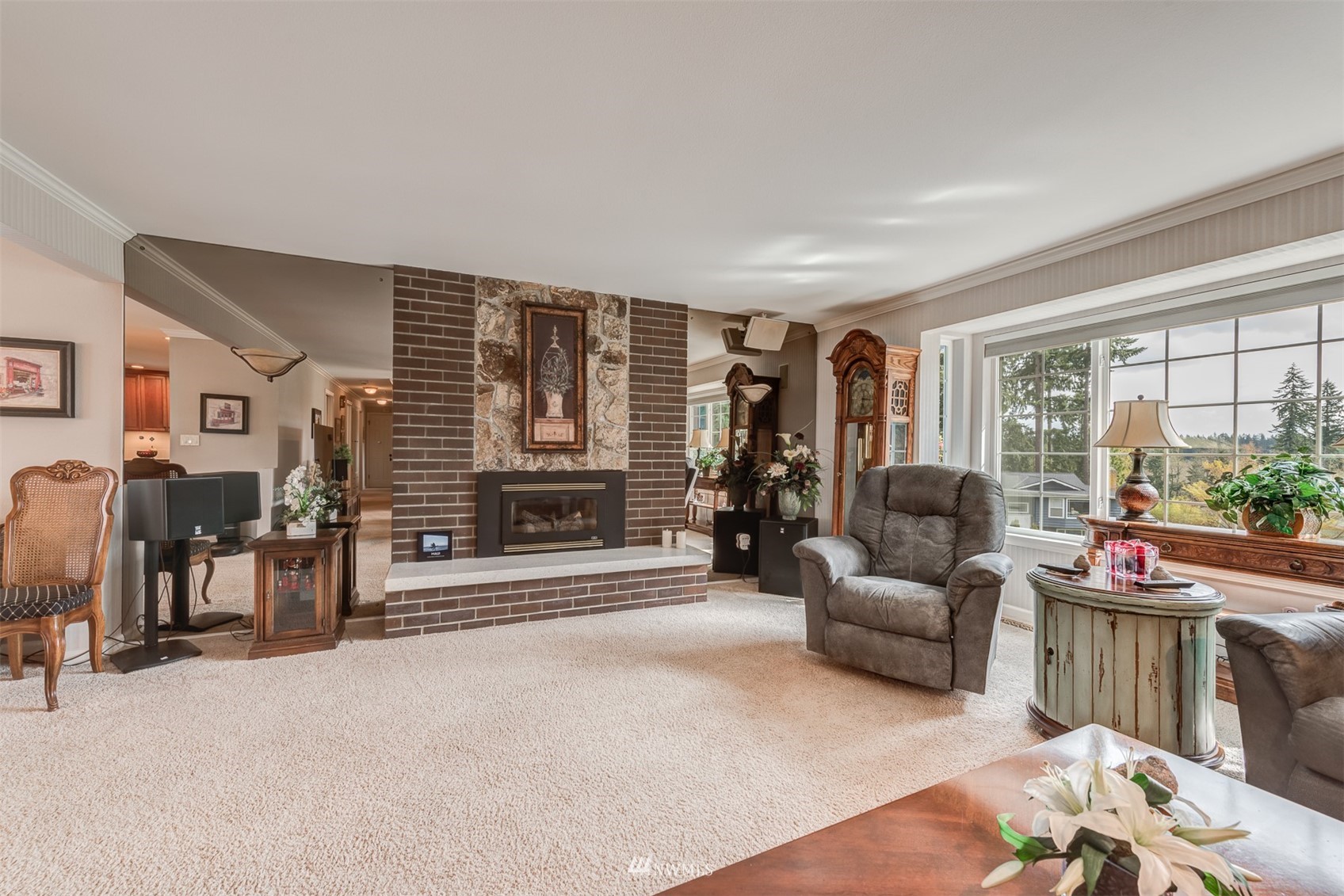 213 155th Place Southeast Bothell, WA 98012 - Photo 6 of 37 a living room with furniture floor to ceiling window and a flat screen tv