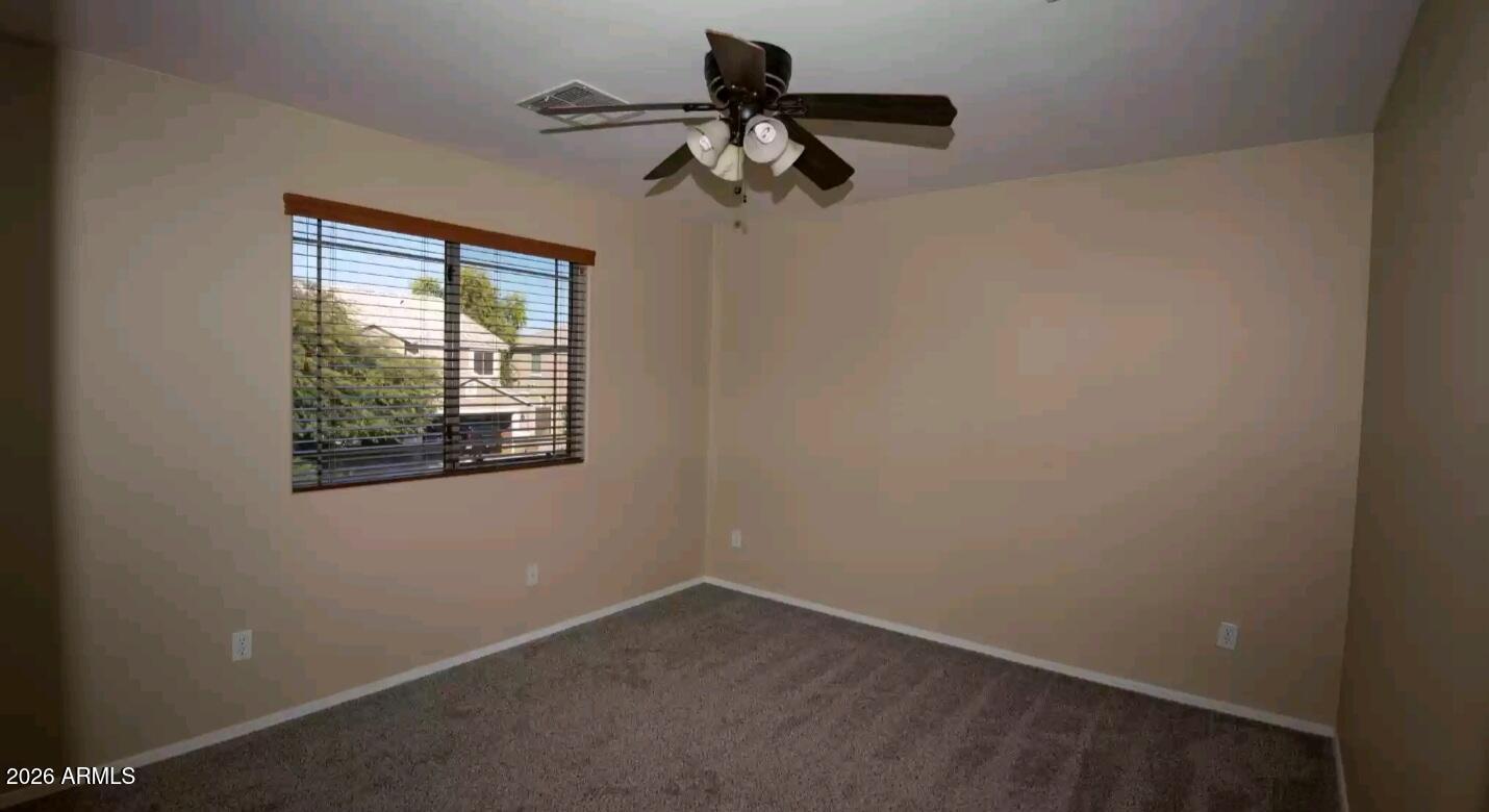2321 West Steed Ridge Phoenix, AZ 85085 - Photo 11 of 14 an empty room with a window