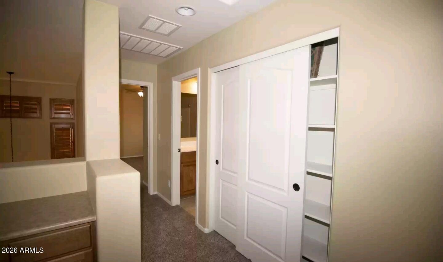 2321 West Steed Ridge Phoenix, AZ 85085 - Photo 10 of 14 a view of hallway with furniture and a mirror