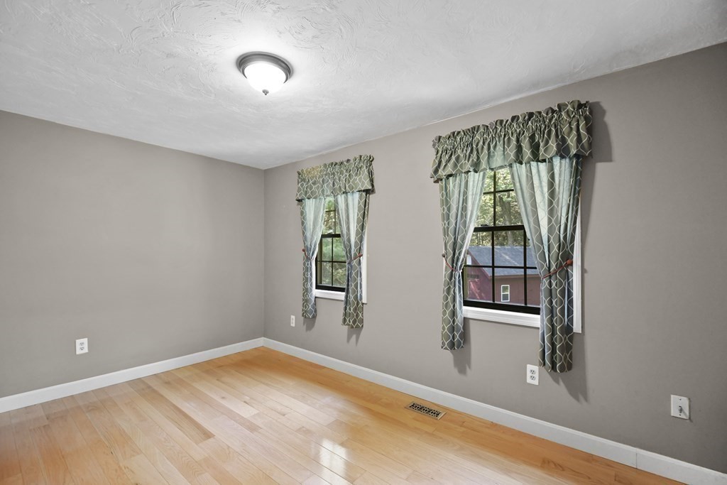 73 Hill Road Charlton, MA 01507 - Photo 14 of 32 wooden floor in an empty room with a window