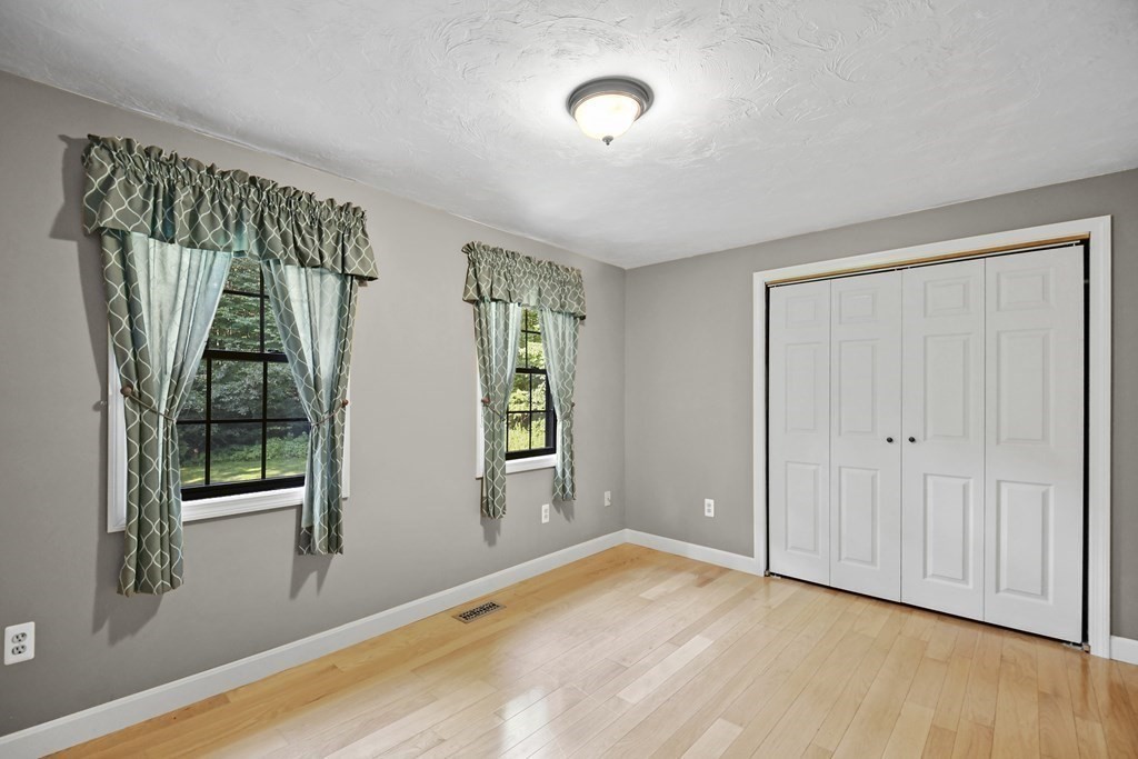 73 Hill Road Charlton, MA 01507 - Photo 15 of 32 a view of an empty room with glass door and a window