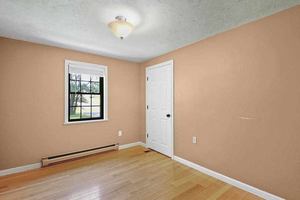 73 Hill Road Charlton, MA 01507 - Photo 18 of 32 an empty room with a window