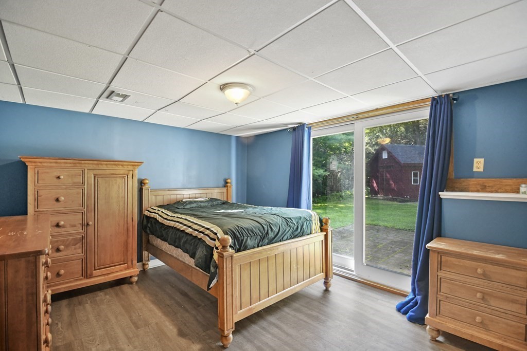 73 Hill Road Charlton, MA 01507 - Photo 21 of 32 a bedroom with a bed and a dresser