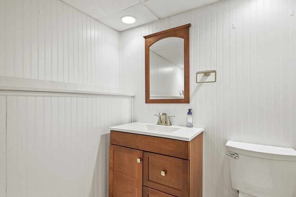 73 Hill Road Charlton, MA 01507 - Photo 23 of 32 a bathroom with a sink vanity and a mirror