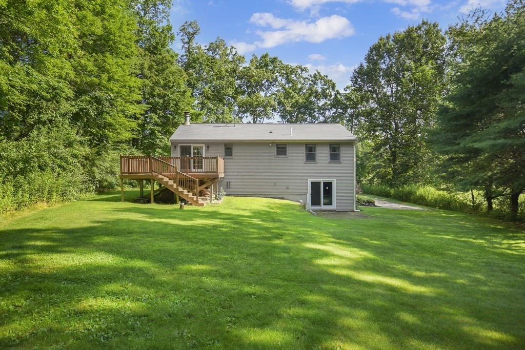 73 Hill Road Charlton, MA 01507 - Photo 28 of 32 a view of a house with a backyard
