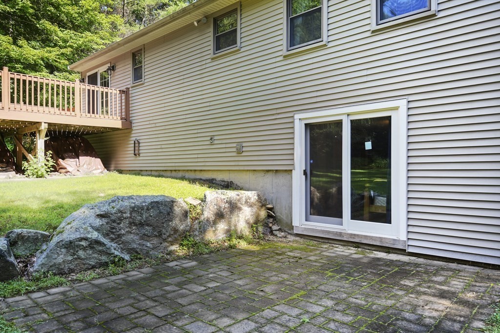 73 Hill Road Charlton, MA 01507 - Photo 29 of 32 a front view of a house with a yard