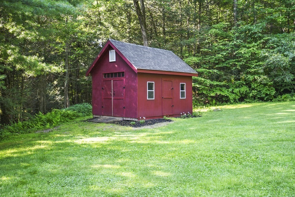 73 Hill Road Charlton, MA 01507 - Photo 32 of 32 a view of backyard of house with green space