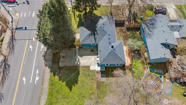an aerial view of a house with a yard